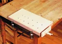 Solid wood workbench top with clamping device and table attachment