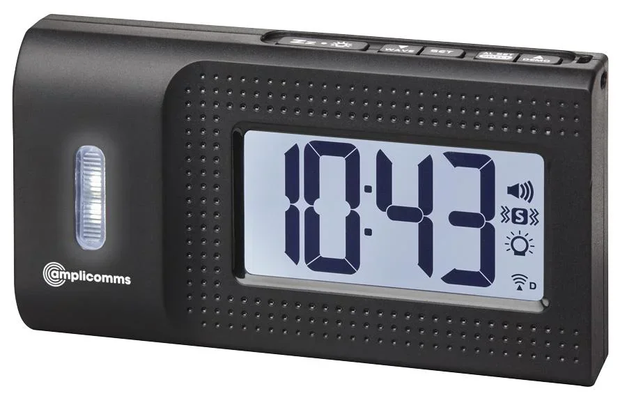 Travel alarm clock with vibrating alarm